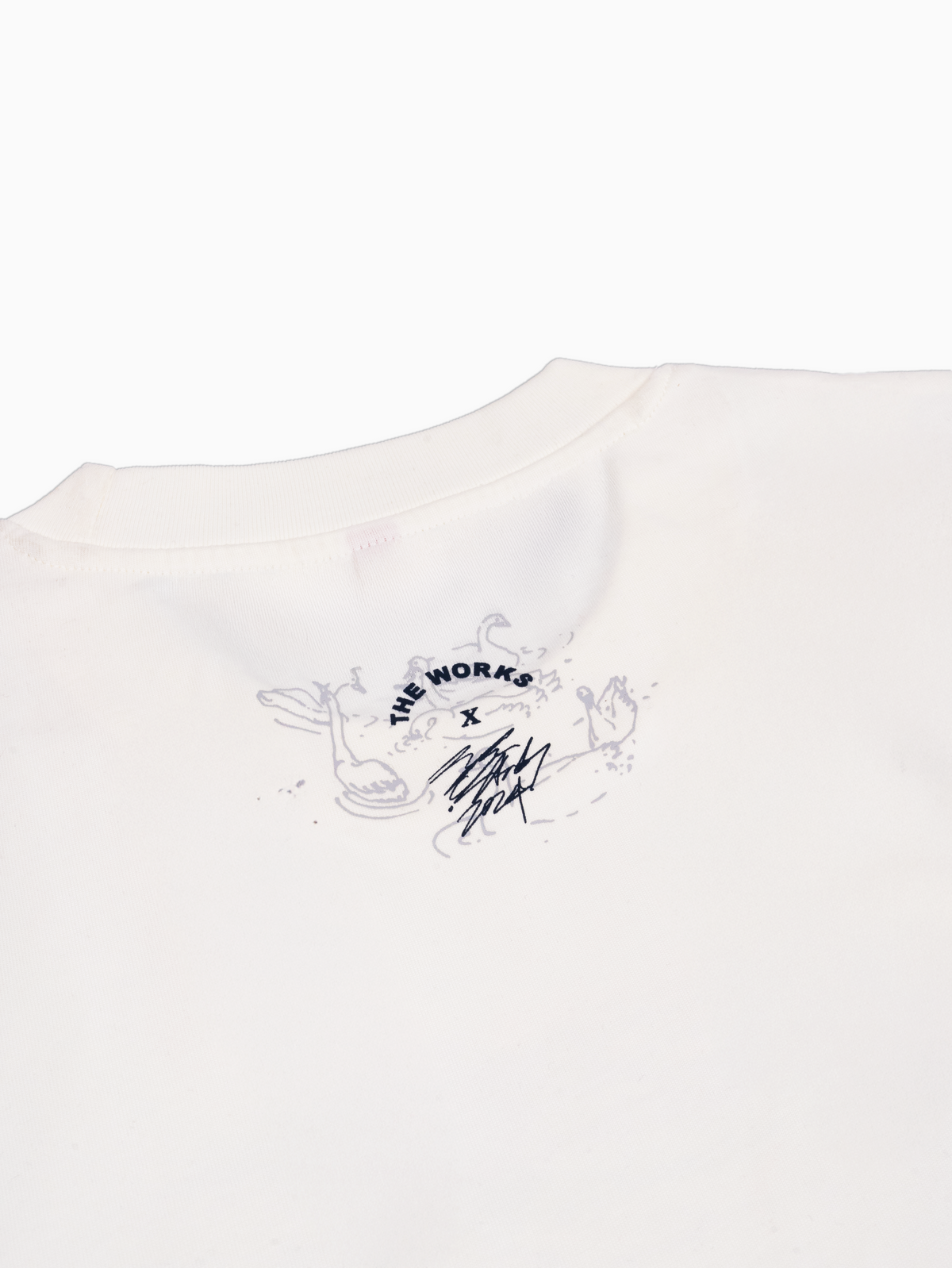 Close up back view of off white rCeramics swan artwork tee shirt by The Works NY